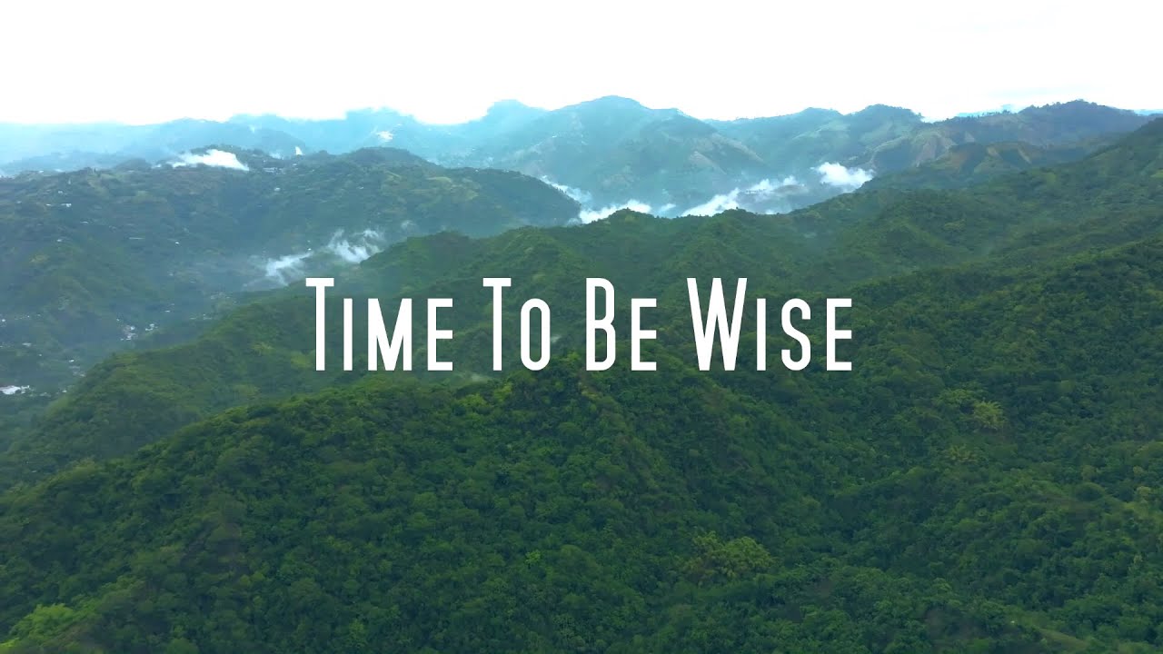 Video still: the title Time To Be Wise over misty green mountains